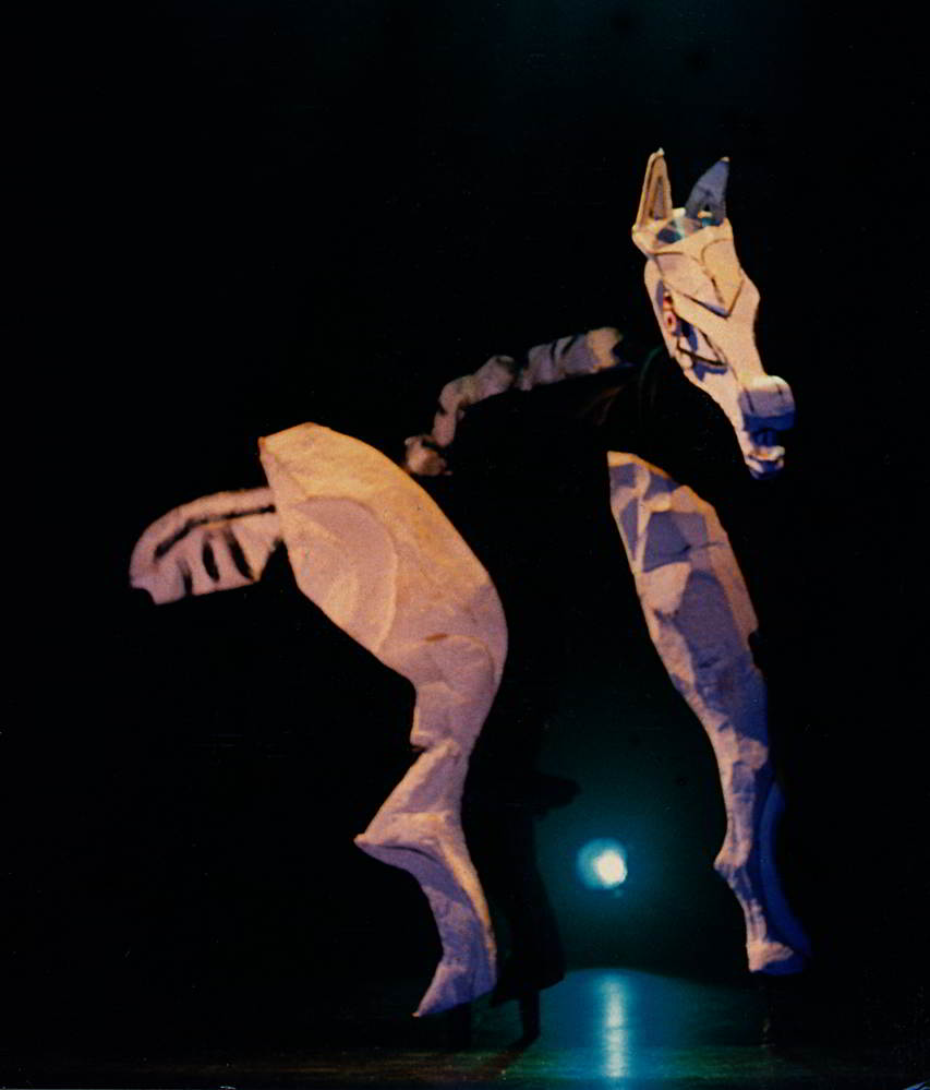 Handspan Theatre Four Little Girls Puppeteer walks on two pairs of stilts costumed as giant horse
