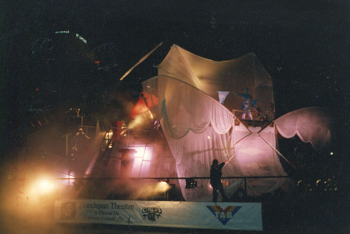 I Dreamt I Could Fly, Handspan Theatre view of barge with elaborate stage set and people manipulating large billowing cloth wings in pink light