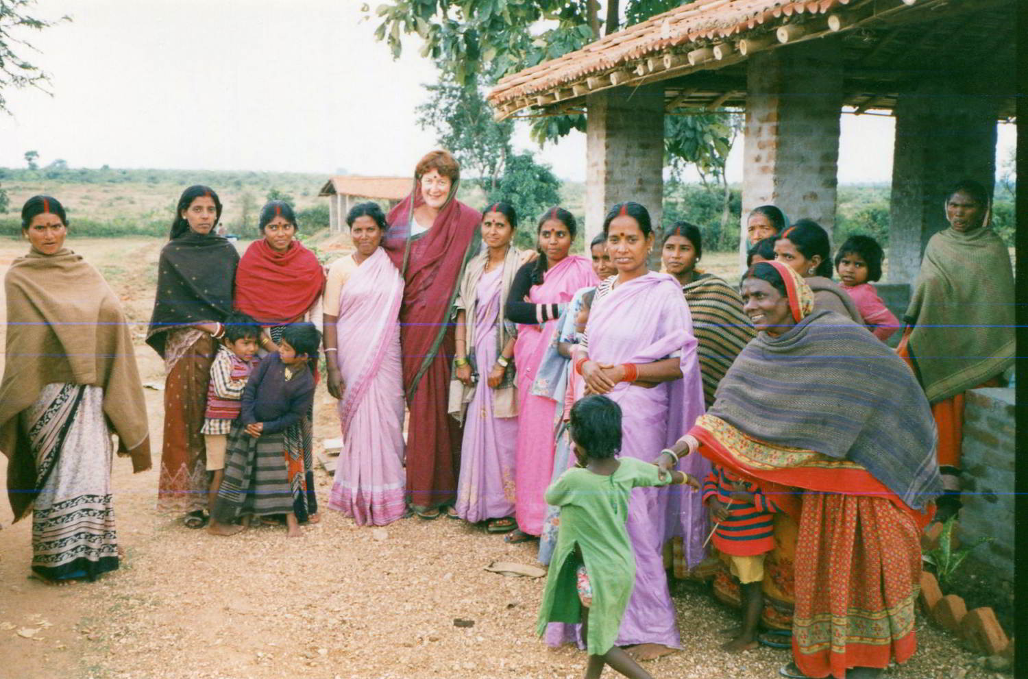Handspan Theatre Banquet research in India group portrait of local villagers dressed in their best with costumed Australian visitor in the middle