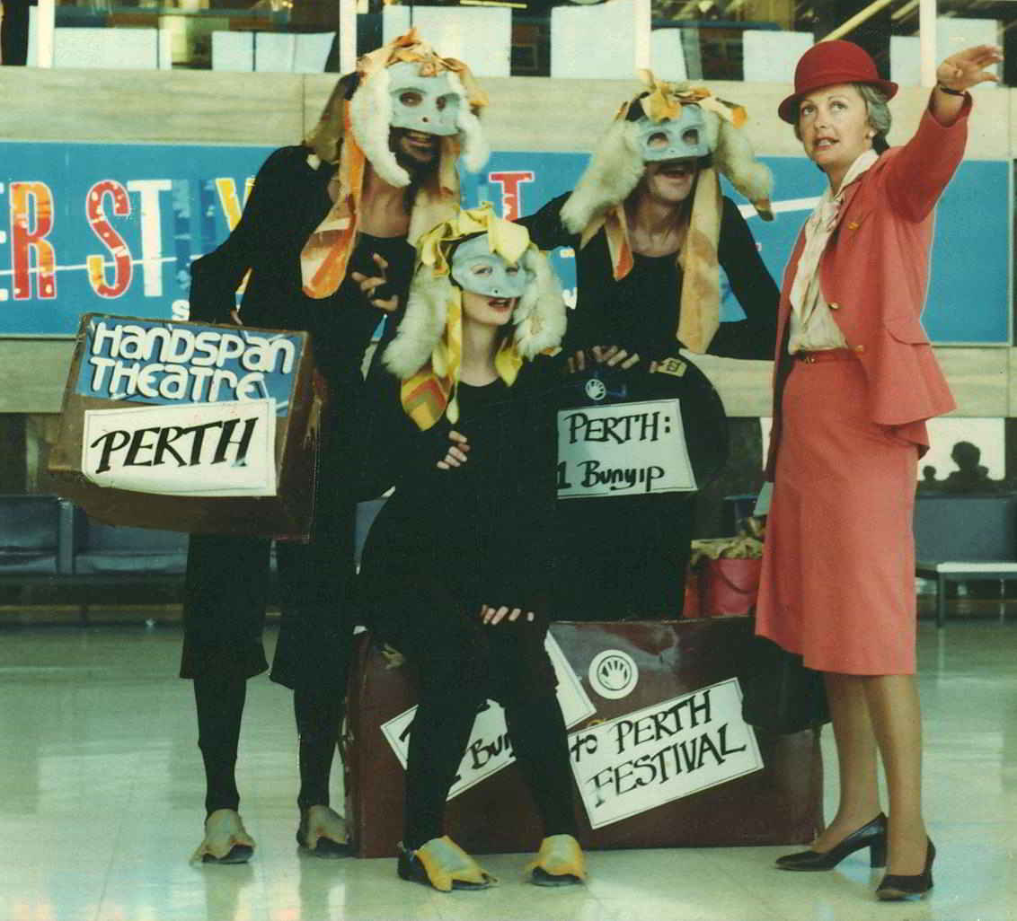 people dressed in bunyip costumes with TAA staff at airport