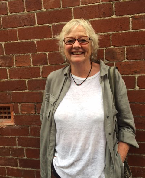 Helen Rickards, Handspan Theatre woman standing in front of brick wall