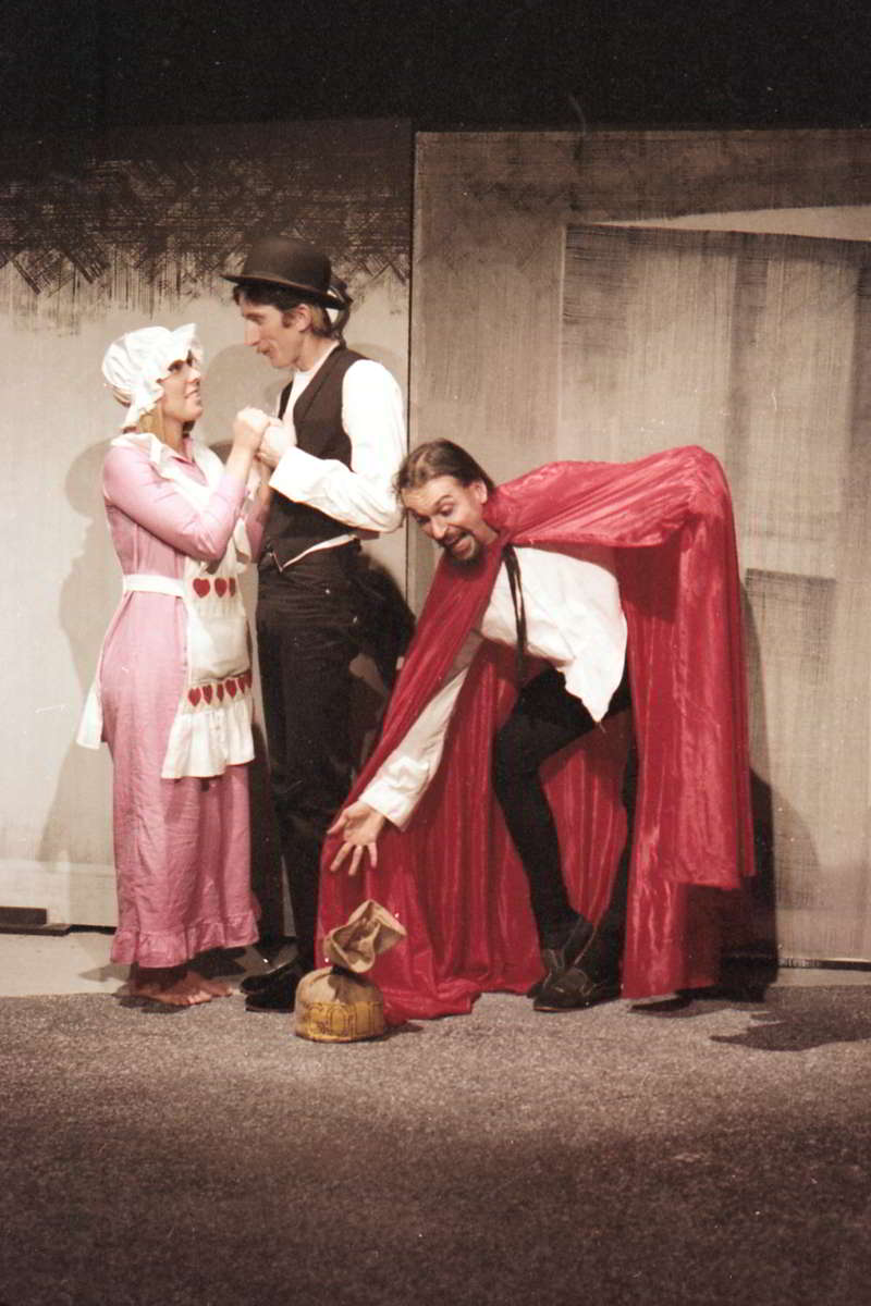 Jandy Malone and the Nine O'Clock Tiger, Handspan Theatre, a melodramatic scene of a man and woman circa 1850s being confronted by a villian in a red and black cloak