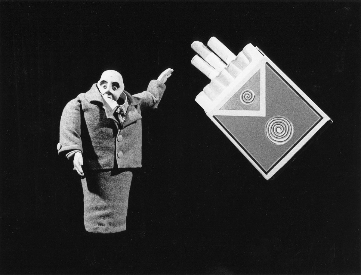 Handspan Theatre Lunatic Soup puppet man offering cigarettes