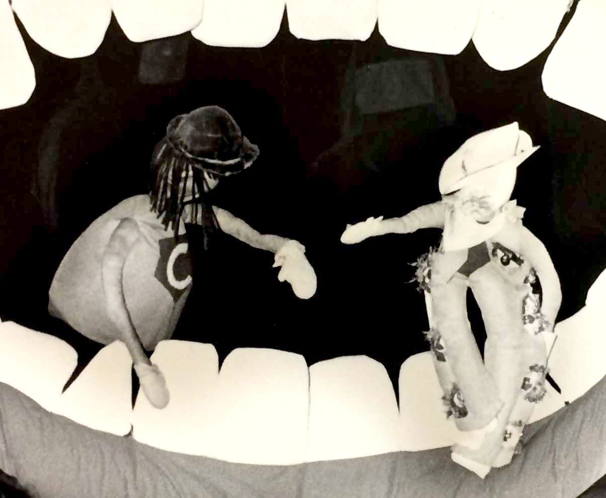 Handspan Theatre The Mouth Show teethcleaning heroes: puppets posing facing each other in the open mouth