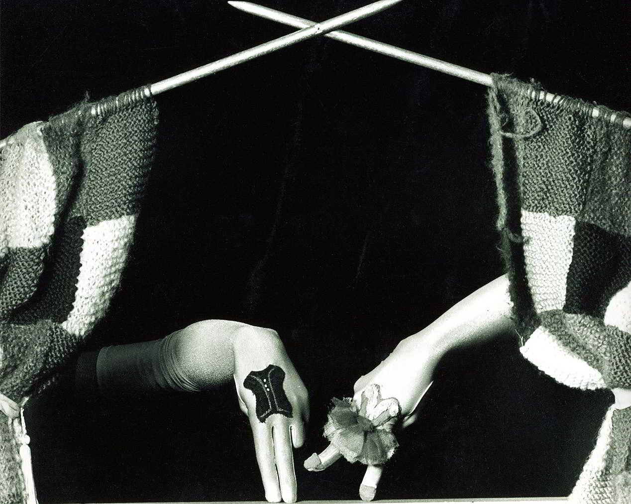 Handspan Theatre Out for A Duck curtain of knitting on needles with dressed fingers dancing