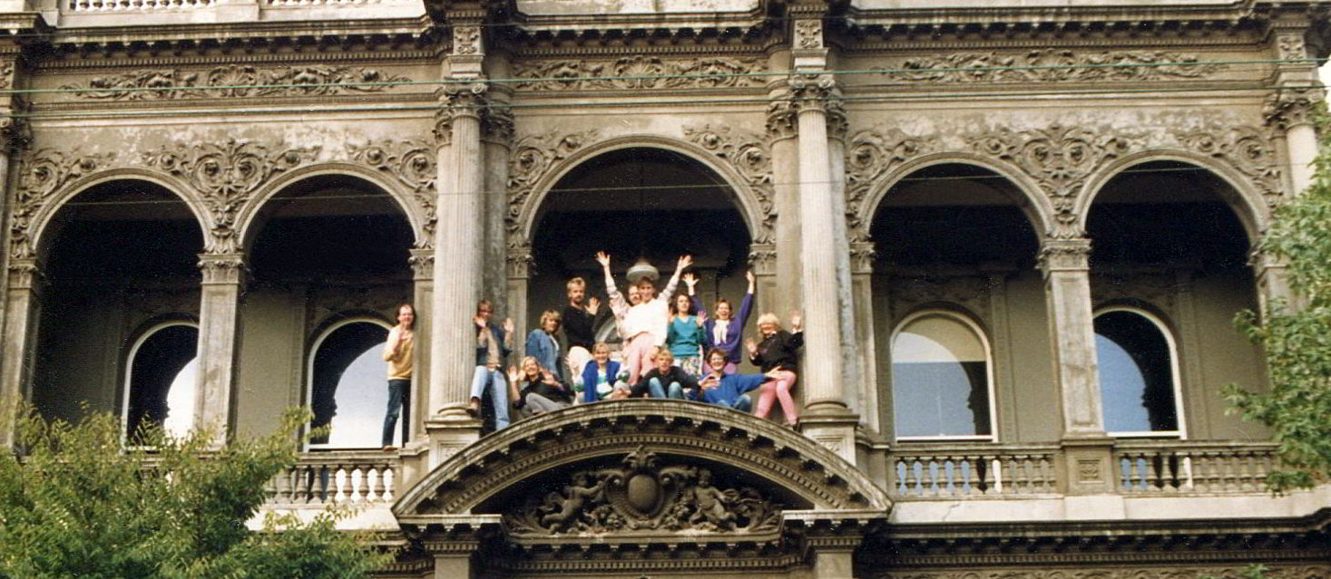 Handspan Theatre Dreaming 1986 company members on the verandah edge of an ornate Victorian building