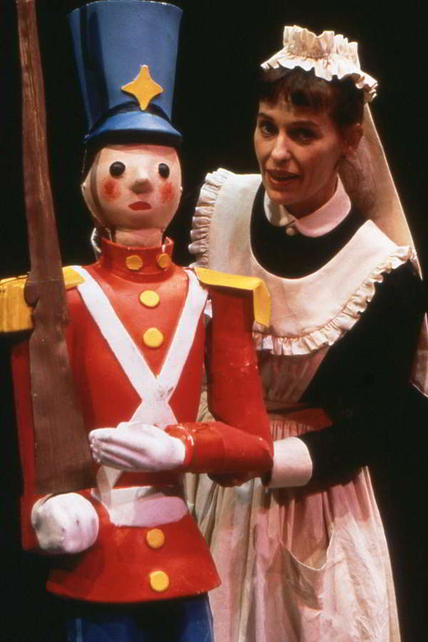 The Tin Soldier Handspan Theatre Woman dressed as a maid with a wooden soldier