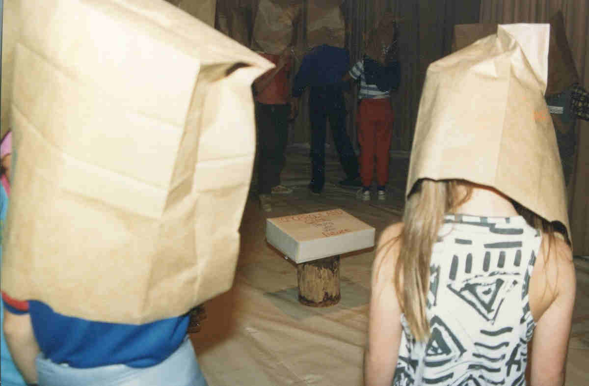 Handspan Theatre Tomorrowland Game participants surrounding a box