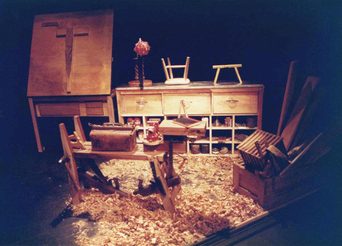 The Wooden Child Handspan Theatre carpenter's workshop with benches, tools and floor covered with wood-shavings