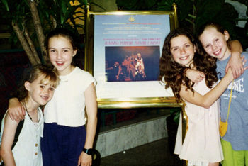 four girls in theatre foyer