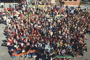 huge crowd of young people with puppets and objects photographed from above
