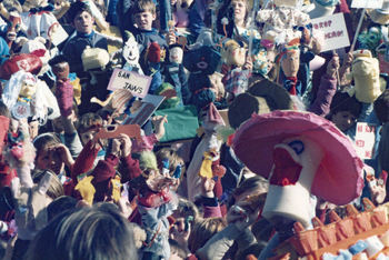 section of same crowd of puppets and puppeteers