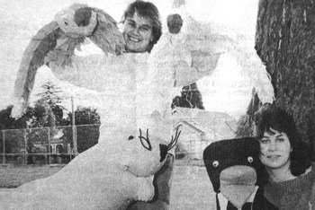 two teenagers with their large soft-sculpture puppets - polar bear, two cockatoos and two penguins