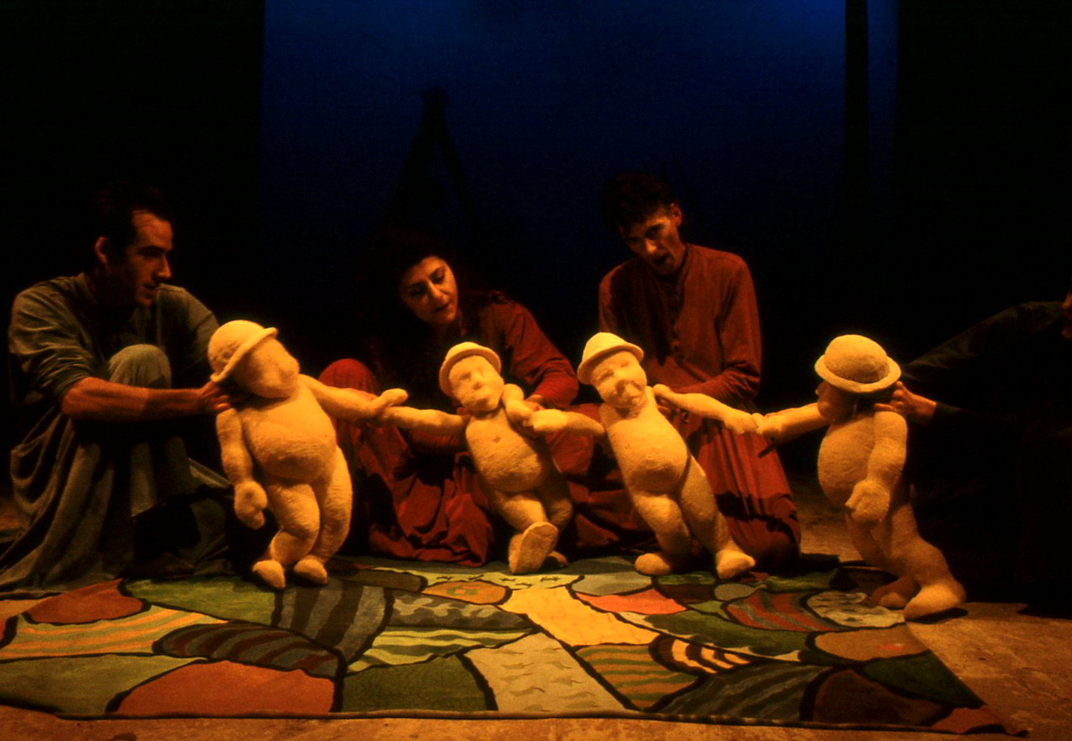 handspan Theatre Banquet 3 puppeteers with 4 foam sculpted figures wearing hats on patchwork floorcloth