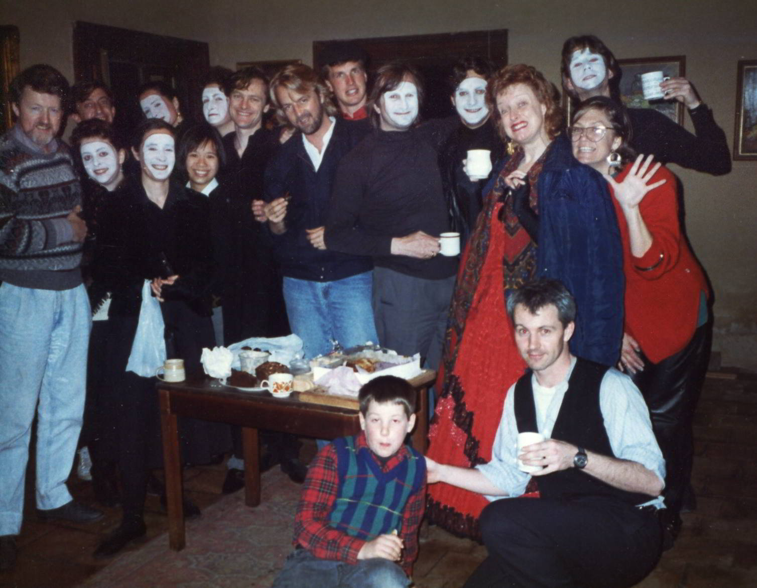 Elision and Handspan group photo of performing company, including musicians in white face make up