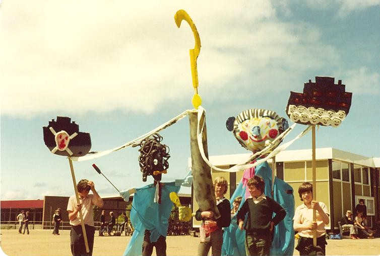 Portland High School, Victoria 5 boys in a high-school playground with two life-size puppets and 3 objects on sticks