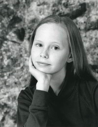 Handspan Theatre portrait of a young girl with head leaning on her hand