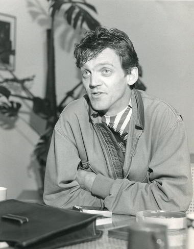 Nigel Triffitt Handspan Theatre black and white portrait of a man seated at a table