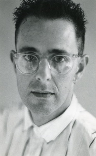 Handspan Theatre Peter Crosbie portrait of dark-haired man wearing glasses