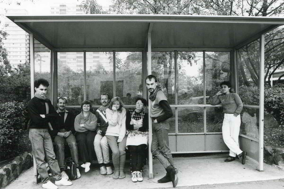 Streetwise Handspan Theatre Publicity photo 8 people in a bus shelter in front of high rise flats